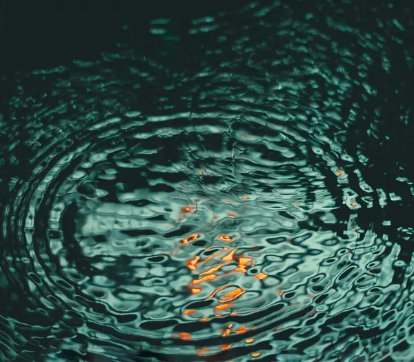 Inclusive services at Designer Motel glockna Water surface with concentric ripples and orange light reflections
