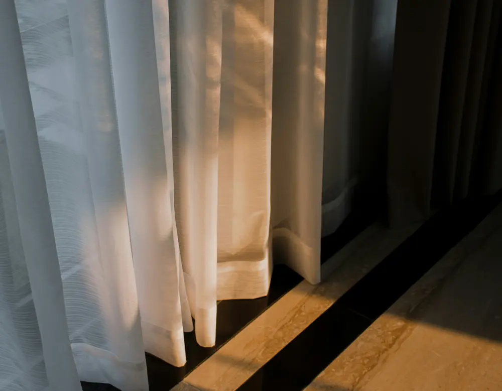 Frequently asked questions about Designer Motel glockna Sunlight shining through white curtains onto a marble floor