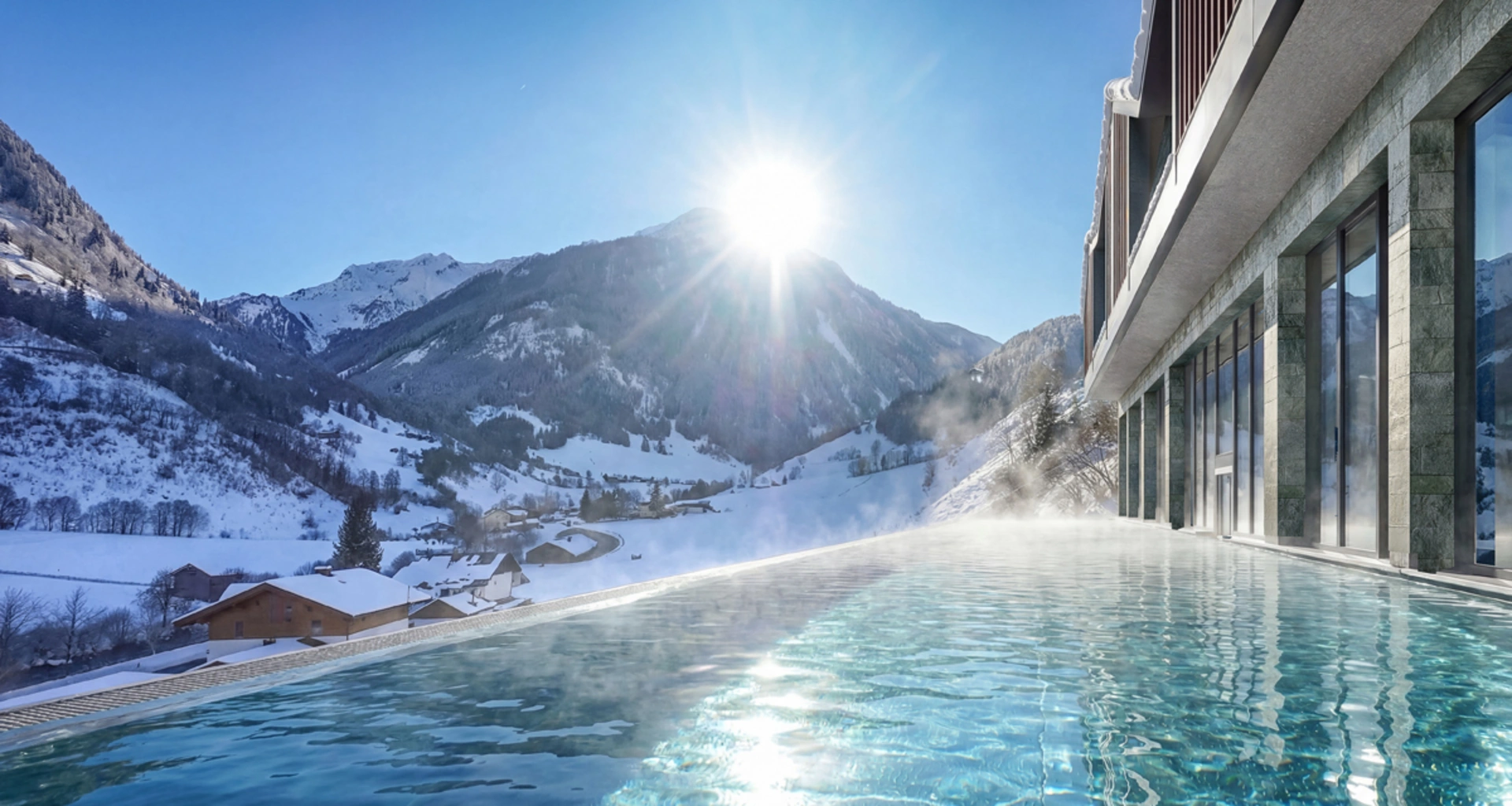 Infinity-Pool mit Bergblick und Sonnenschein in verschneiter Winterlandschaft